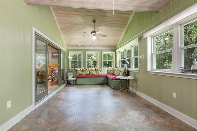 unfurnished sunroom with wood ceiling, ceiling fan, and vaulted ceiling