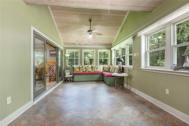 unfurnished sunroom with ceiling fan, vaulted ceiling, and wooden ceiling