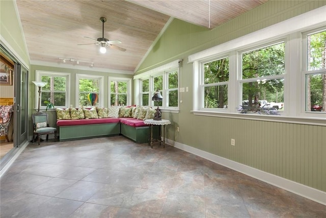 unfurnished sunroom with wood ceiling, ceiling fan, rail lighting, and vaulted ceiling