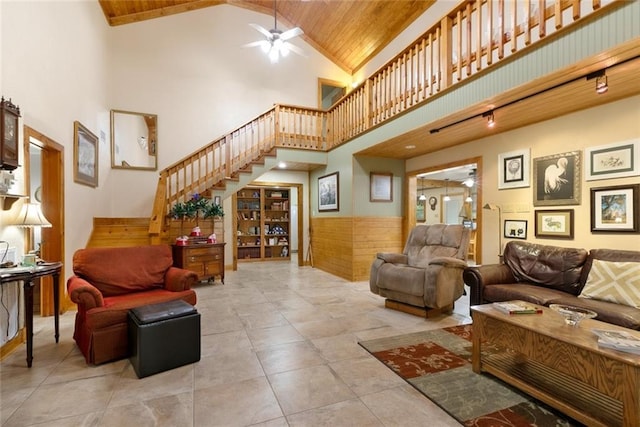 living room with light tile patterned flooring, ceiling fan, high vaulted ceiling, and wood ceiling