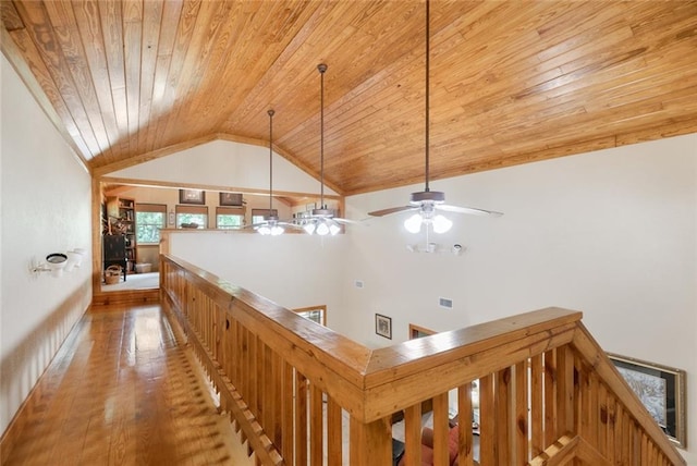 corridor with lofted ceiling, wood ceiling, and wood-type flooring