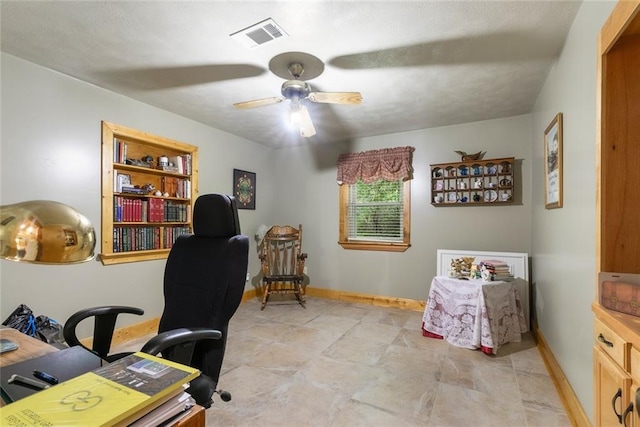 office area featuring light tile patterned floors and ceiling fan