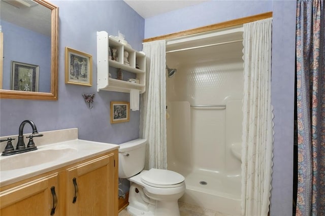 bathroom featuring vanity, toilet, and a shower with shower curtain