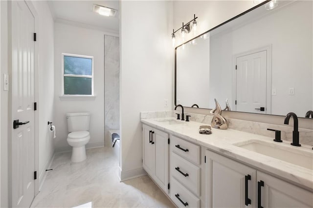 bathroom featuring a sink, toilet, marble finish floor, and double vanity