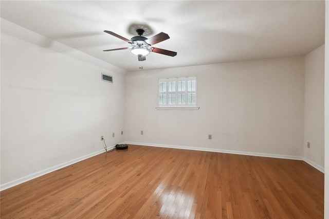 unfurnished room featuring ceiling fan and light hardwood / wood-style flooring