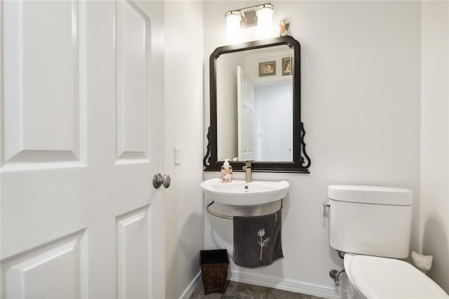 bathroom with toilet and sink