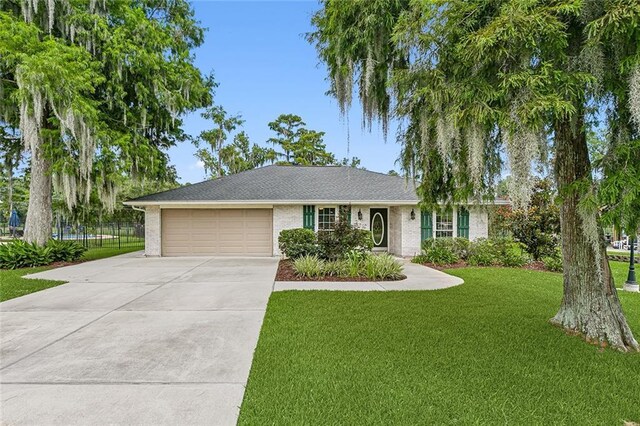 single story home with a front lawn and a garage