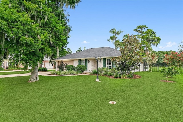 ranch-style house with a front lawn