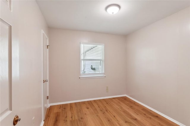 spare room with light wood-type flooring