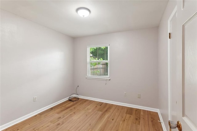 spare room featuring light hardwood / wood-style floors