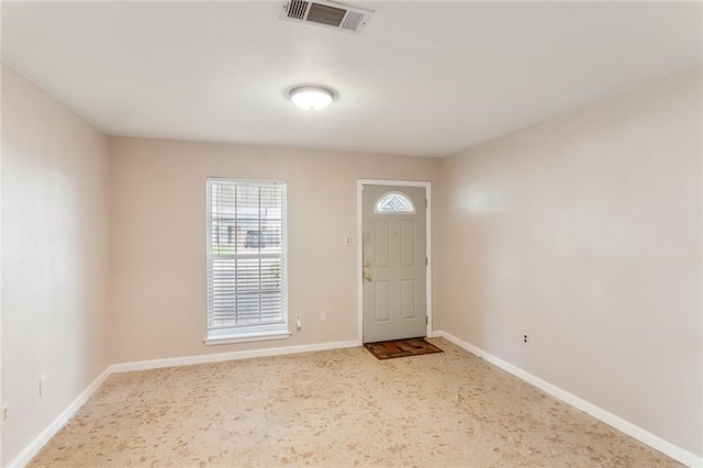 view of carpeted entrance foyer