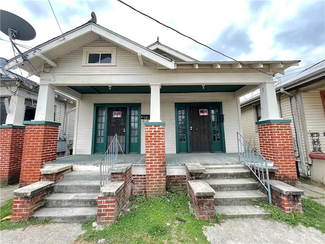 property entrance featuring covered porch