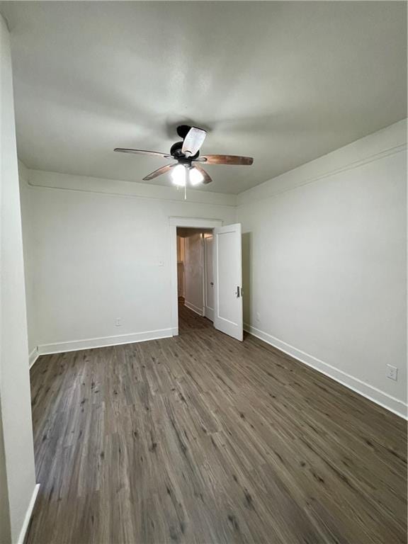 unfurnished bedroom featuring dark hardwood / wood-style flooring and ceiling fan