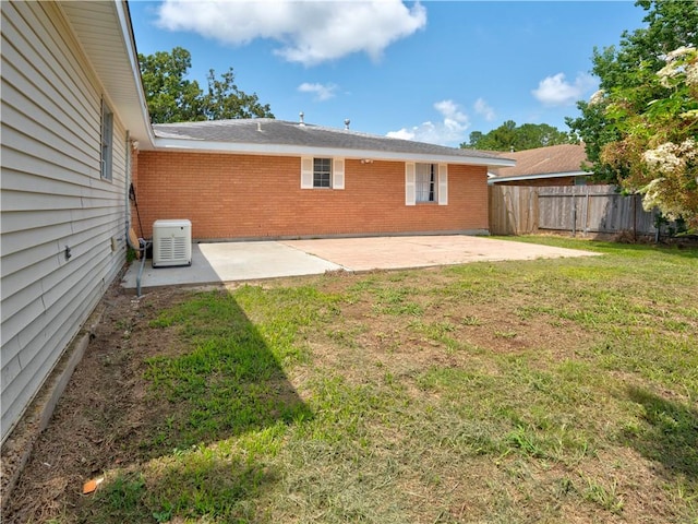 view of yard featuring a patio and central AC