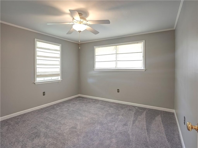 carpeted spare room featuring crown molding and ceiling fan