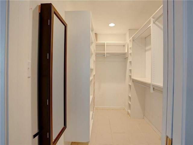 spacious closet featuring light tile floors