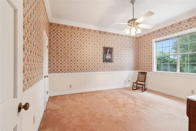 unfurnished room with light carpet, crown molding, and ceiling fan