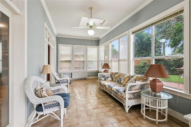 sunroom with ceiling fan and plenty of natural light