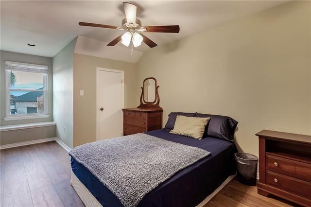 bedroom with ceiling fan and hardwood / wood-style flooring