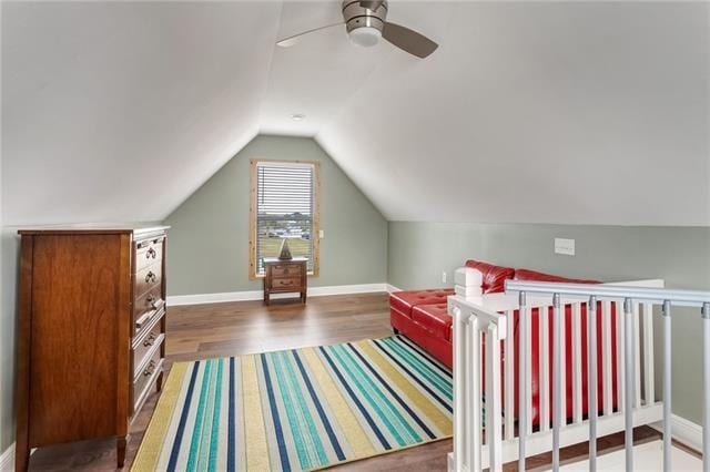 bonus room with ceiling fan, vaulted ceiling, and hardwood / wood-style flooring