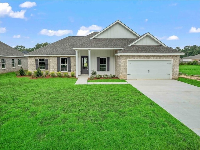 view of front facade featuring a garage and a front lawn