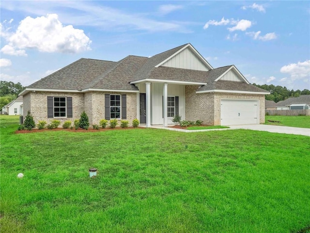 view of front of home with a garage and a front lawn