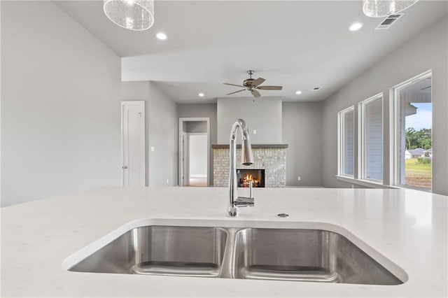 kitchen featuring pendant lighting, sink, and ceiling fan