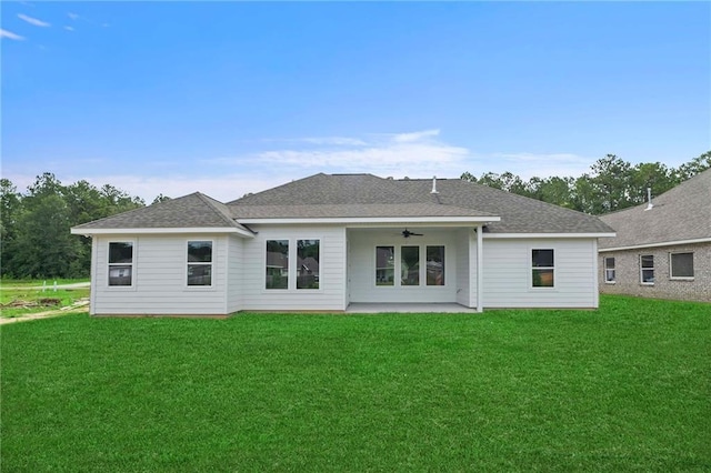 back of house featuring a patio, ceiling fan, and a lawn