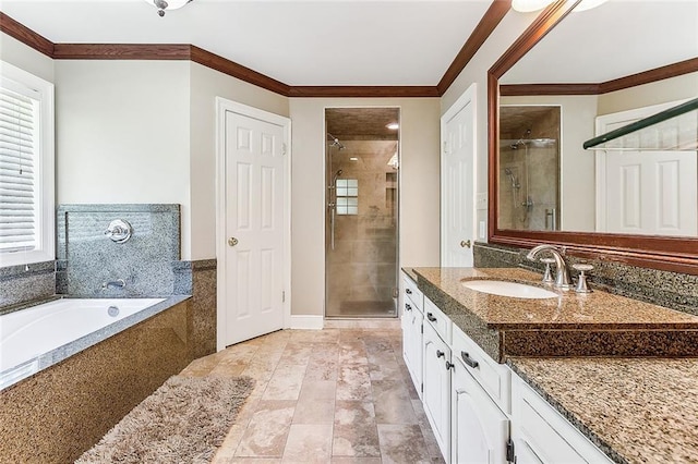 bathroom featuring vanity, a healthy amount of sunlight, and shower with separate bathtub