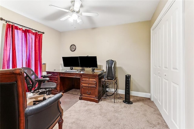 office area featuring light colored carpet and ceiling fan