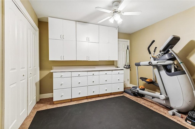 workout room with ceiling fan