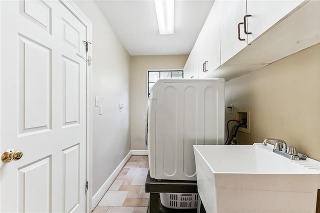 laundry room with cabinets, washer hookup, and sink