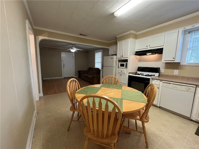 651 Avenue E Ave E, Westwego, LA 70094 - dining room with a ceiling fan, ornamental molding, healthy amount of natural light, and light floors