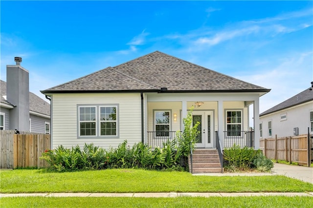 bungalow featuring a front yard