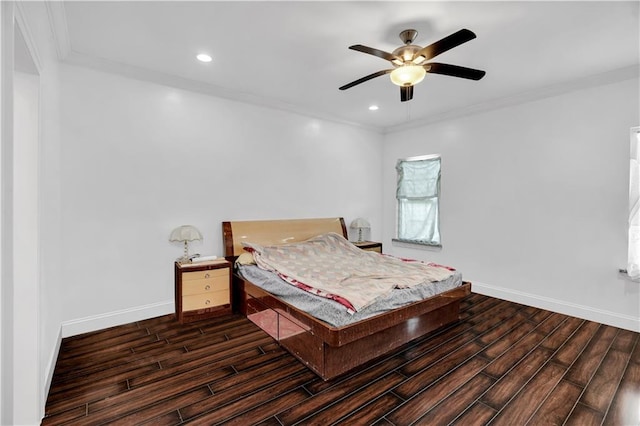 bedroom with ceiling fan, dark hardwood / wood-style flooring, and ornamental molding