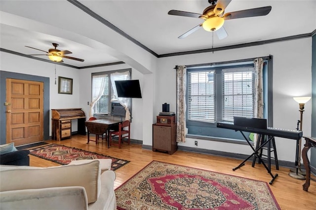 living room with crown molding, a healthy amount of sunlight, and hardwood / wood-style floors