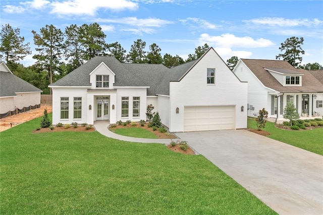 view of front of house featuring a front lawn and a garage