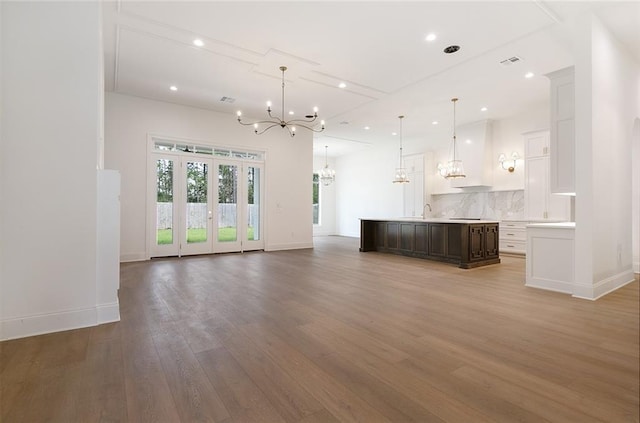 unfurnished living room featuring hardwood / wood-style floors