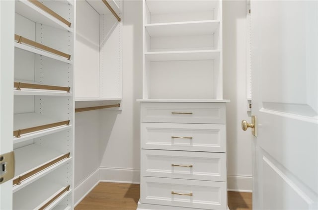 spacious closet featuring light hardwood / wood-style floors