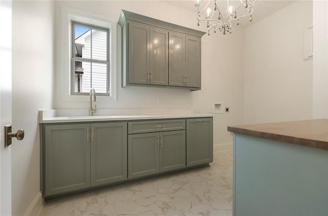 kitchen with a notable chandelier and sink