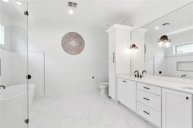 bathroom featuring crown molding, a washtub, vanity, and toilet