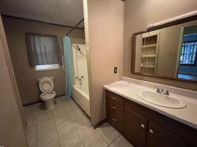 full bathroom with tile patterned flooring, vanity, toilet, and shower / bath combo with shower curtain