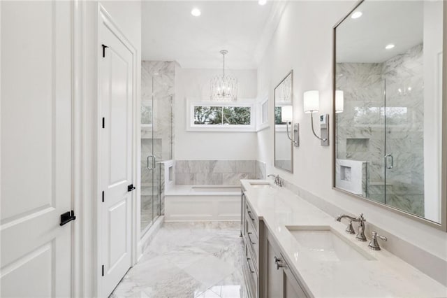 bathroom with an inviting chandelier, separate shower and tub, vanity with extensive cabinet space, dual sinks, and tile floors