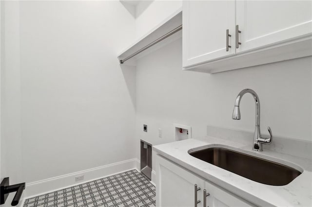 laundry area featuring cabinets, washer hookup, electric dryer hookup, sink, and light tile floors