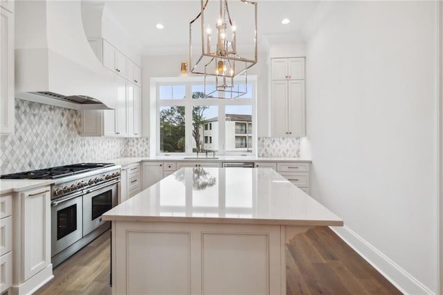 kitchen featuring custom range hood, light hardwood / wood-style flooring, backsplash, a center island, and double oven range