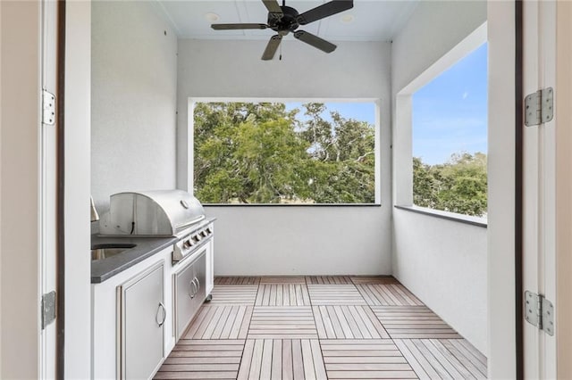 balcony with grilling area, area for grilling, and ceiling fan