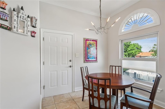 dining space with plenty of natural light, light tile patterned flooring, ornamental molding, and a chandelier