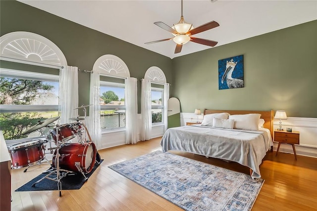 bedroom with light wood-type flooring and ceiling fan