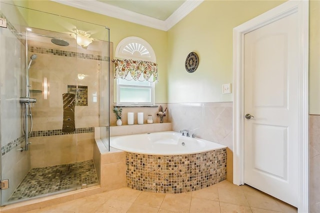 bathroom featuring tile patterned floors, separate shower and tub, tile walls, and ornamental molding