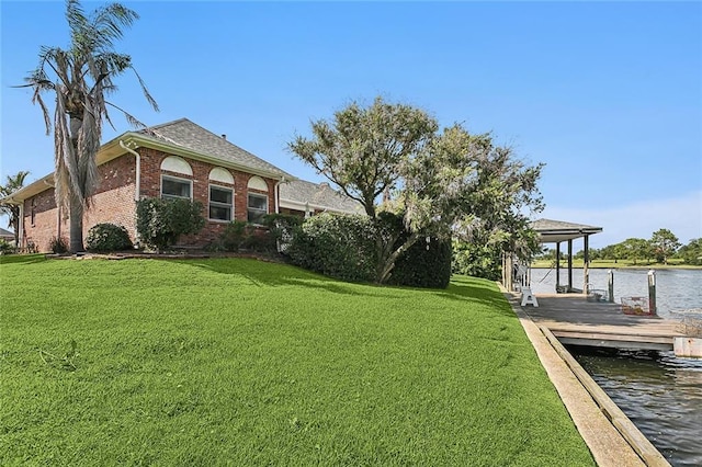 exterior space featuring a yard and a water view